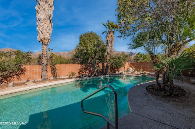 view of pool with a mountain view