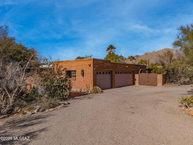 view of front of house featuring a mountain view and a garage