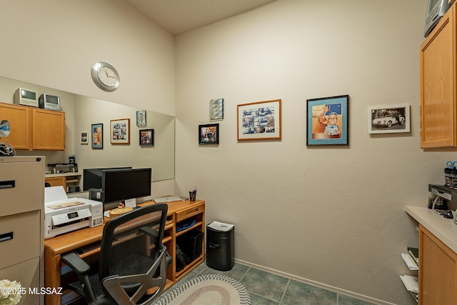 office with dark tile patterned floors