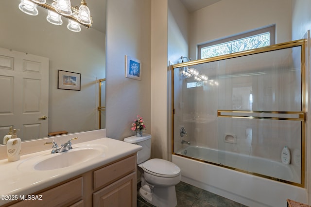 full bathroom with shower / bath combination with glass door, toilet, tile patterned floors, and vanity