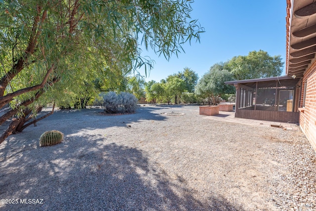 view of yard with a sunroom