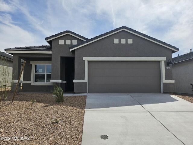 view of front of home featuring a mountain view and a garage