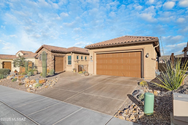 mediterranean / spanish home featuring a garage