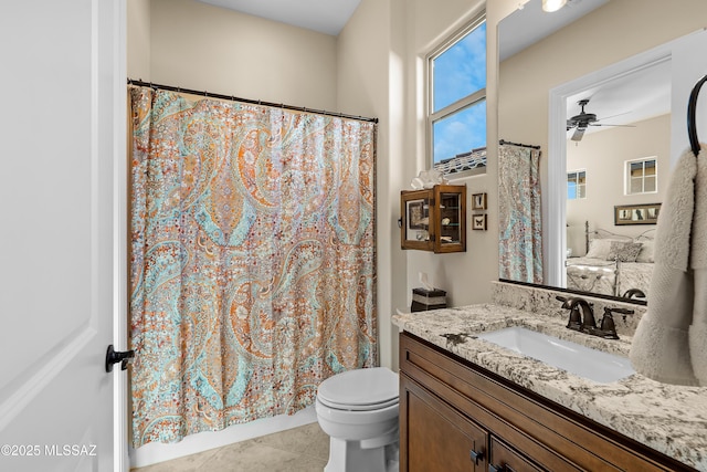 bathroom featuring toilet, ceiling fan, tile patterned floors, and vanity