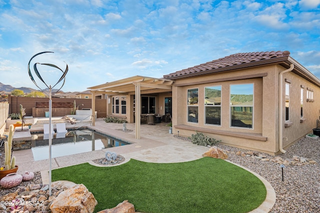 back of house featuring a patio area and a pergola