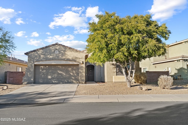 7826 W Sage Creek Ct, Tucson, AZ 85743 - view of front facade with stucco siding, an attached garage, and concrete driveway