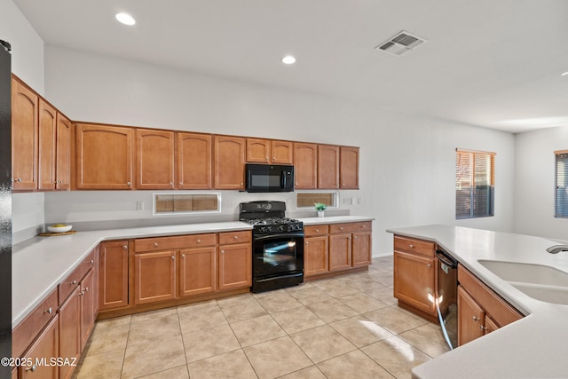 7826 W Sage Creek Ct, Tucson, AZ 85743 - kitchen featuring black appliances, a sink, brown cabinets, and recessed lighting