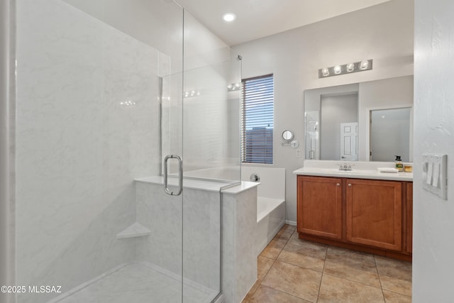 bathroom with tile patterned flooring, vanity, and plus walk in shower