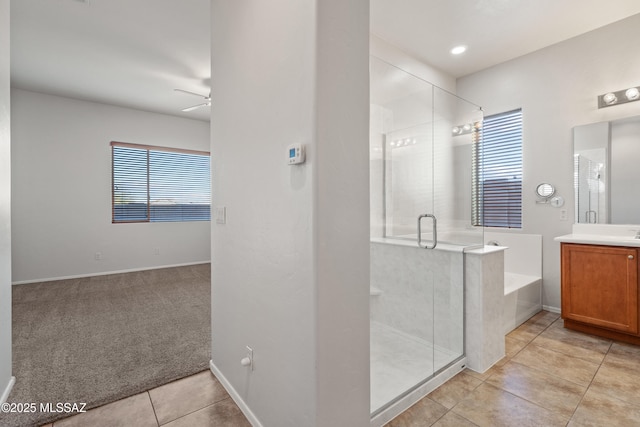 bathroom with shower with separate bathtub, vanity, plenty of natural light, and ceiling fan