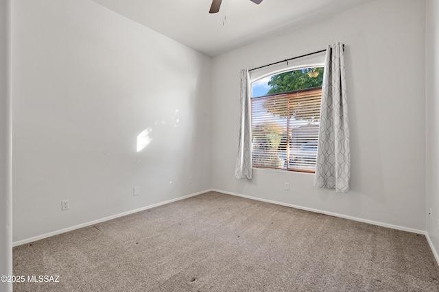 unfurnished room with carpet and ceiling fan