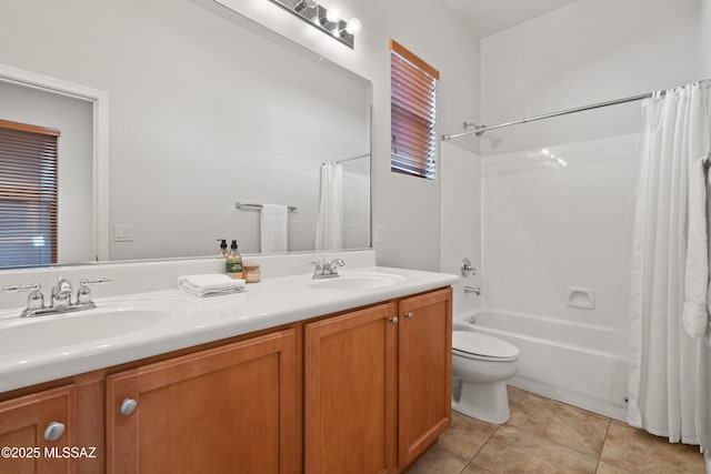 full bathroom with shower / bath combo with shower curtain, tile patterned flooring, vanity, and toilet