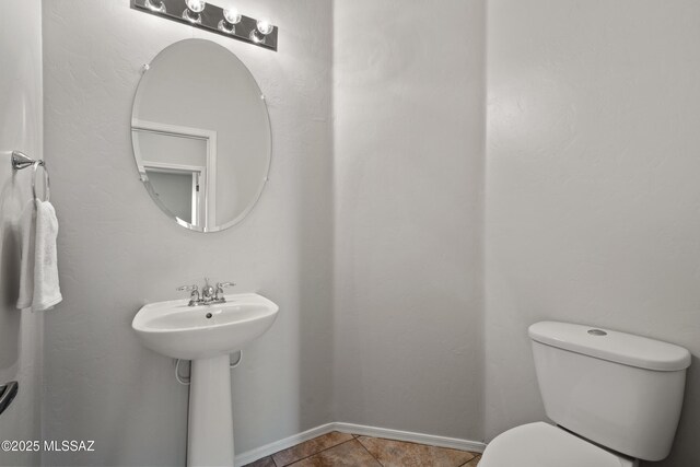 7826 W Sage Creek Ct, Tucson, AZ 85743 - bathroom with toilet, tile patterned flooring, and baseboards