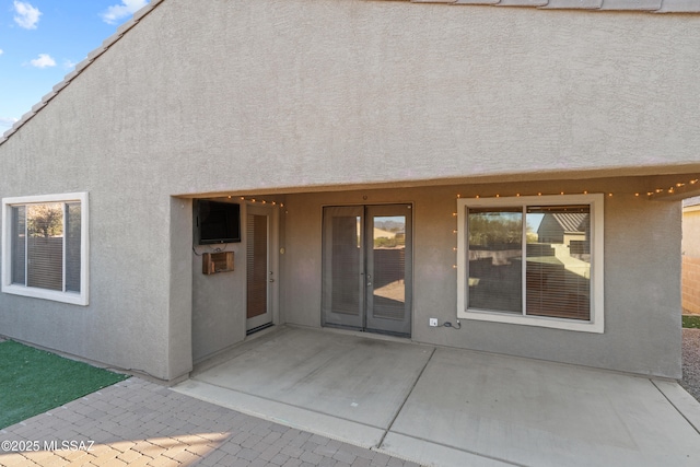 entrance to property featuring a patio area