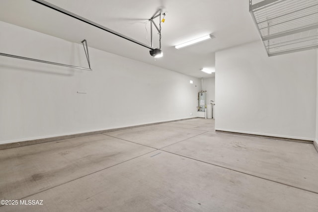 garage featuring a garage door opener and water heater