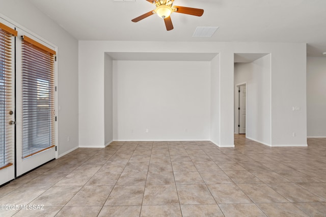 empty room with light tile patterned floors and ceiling fan