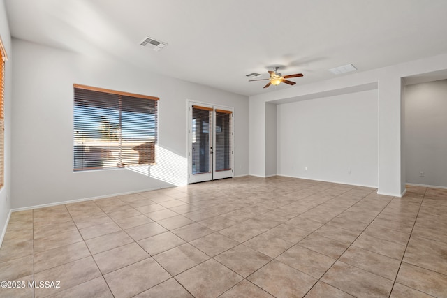 unfurnished room with ceiling fan and light tile patterned floors