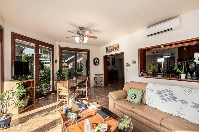 living area with a ceiling fan and a wall unit AC