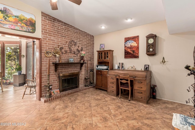 office space with a ceiling fan, baseboards, and a fireplace