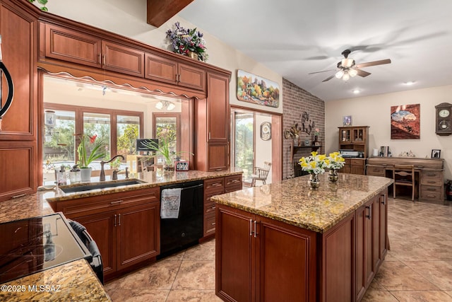 kitchen featuring a brick fireplace, a kitchen island, ceiling fan, a sink, and black appliances