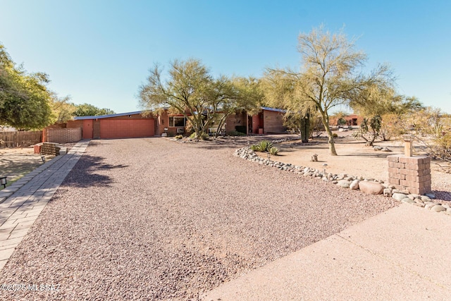 pueblo-style home with a garage