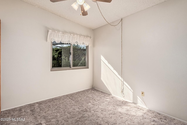 unfurnished room with carpet flooring, a textured ceiling, and ceiling fan