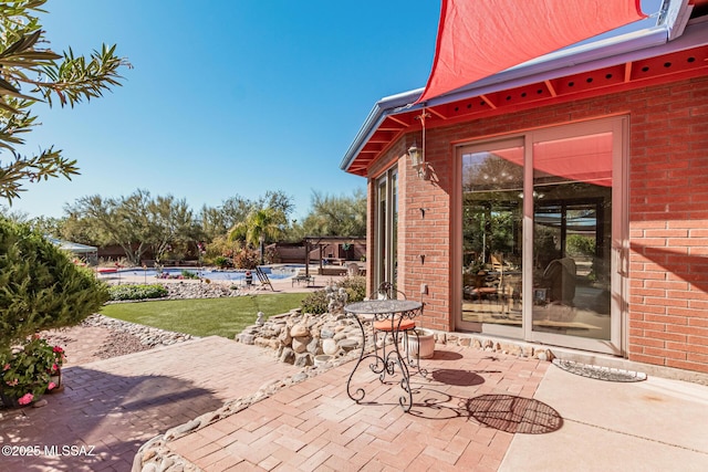 view of patio featuring a pool