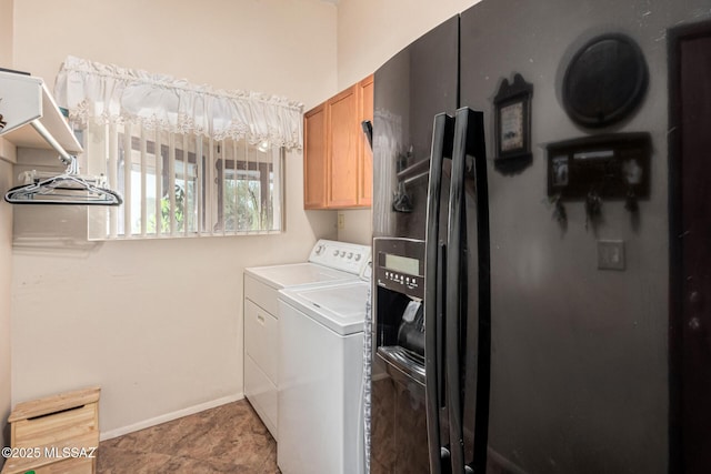 laundry room with cabinets and independent washer and dryer