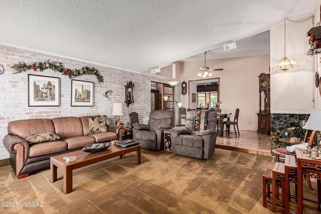 carpeted living room featuring ceiling fan, brick wall, a textured ceiling, and lofted ceiling