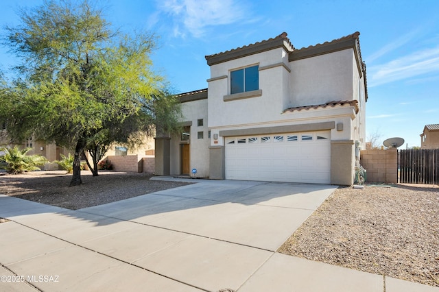 mediterranean / spanish-style home featuring a garage