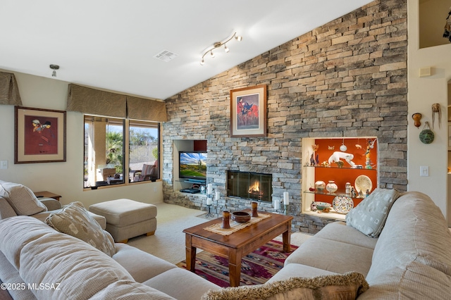 living room with carpet flooring, a fireplace, and vaulted ceiling