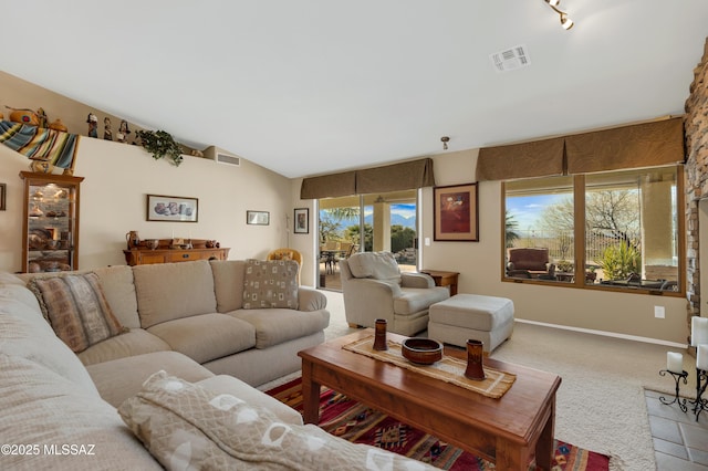 living room featuring light colored carpet and lofted ceiling