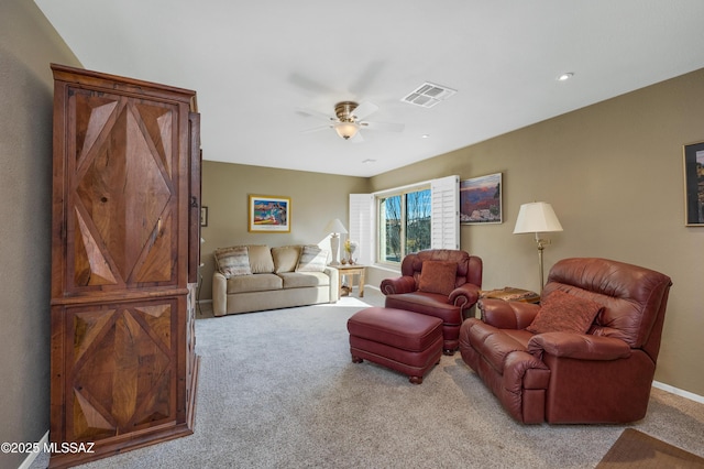 living room featuring light carpet and ceiling fan