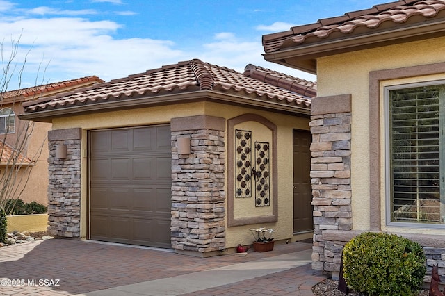 view of exterior entry featuring a garage