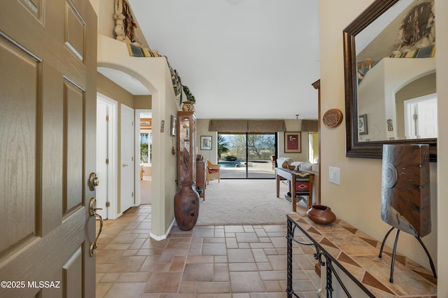 foyer with carpet flooring