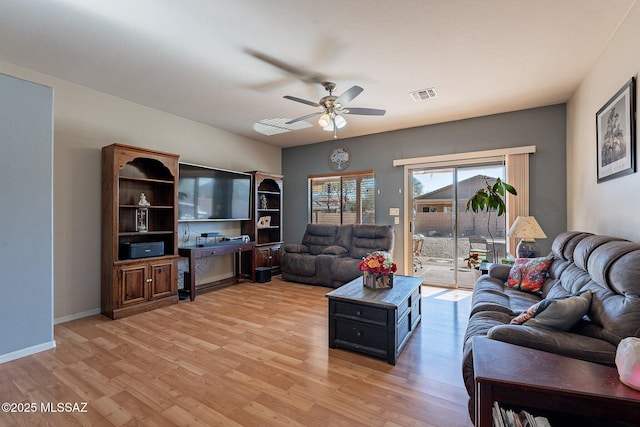 living room with hardwood / wood-style floors and ceiling fan