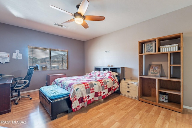 bedroom with ceiling fan and light hardwood / wood-style floors