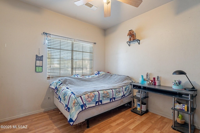 bedroom with ceiling fan and light wood-type flooring