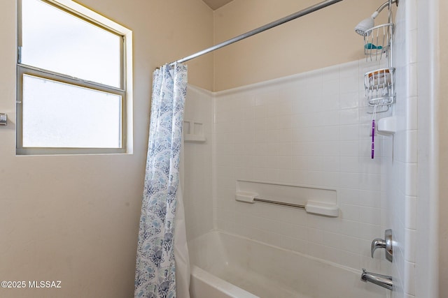 bathroom featuring shower / bath combo with shower curtain