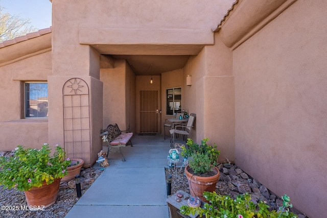 property entrance with a patio area