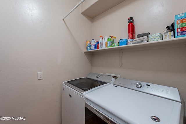 washroom with washing machine and clothes dryer