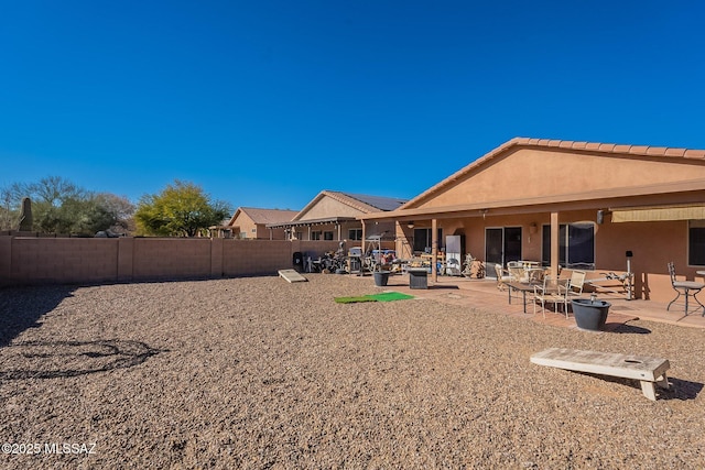 back of house with a patio area