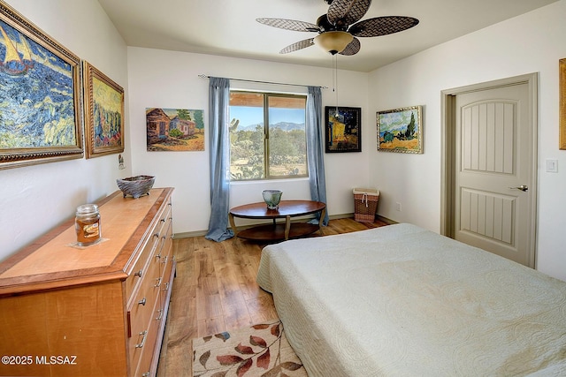 bedroom featuring ceiling fan and light hardwood / wood-style flooring