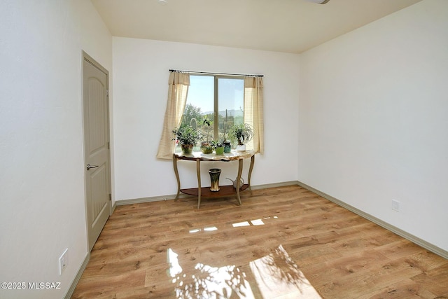 empty room with light hardwood / wood-style floors