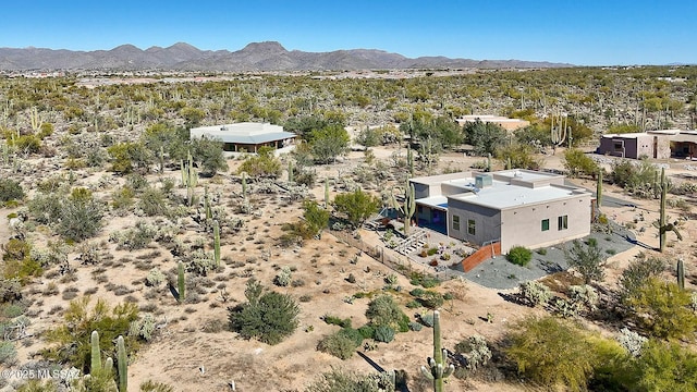 birds eye view of property featuring a mountain view