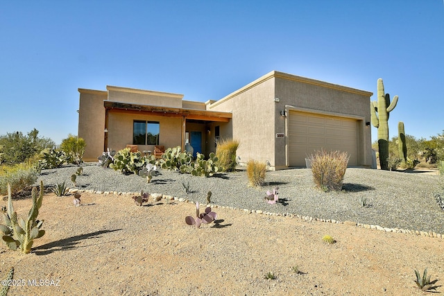 southwest-style home with a garage