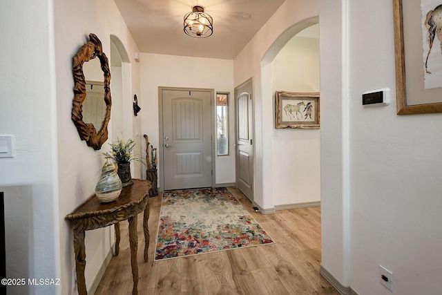 foyer entrance with light wood-type flooring