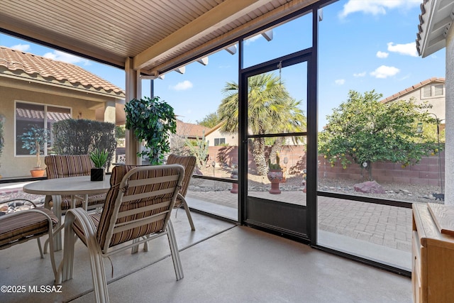 sunroom with wooden ceiling and a wealth of natural light