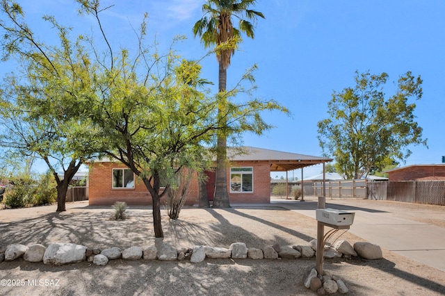 view of front of home featuring a carport