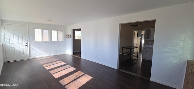 spare room with dark hardwood / wood-style flooring