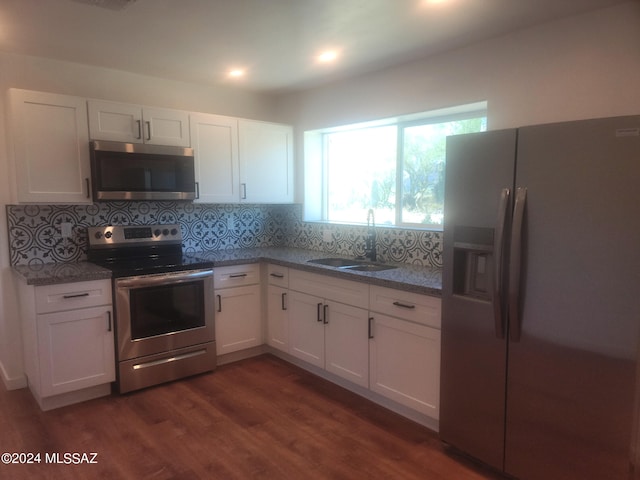 kitchen with white cabinetry, sink, and stainless steel appliances